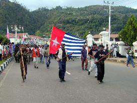Residents parade after declaring independence from Indonesia
